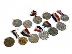 A collection 11 Early 20th C Royal coronation medallions.