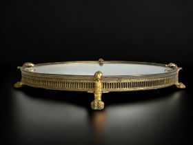 A 19TH CENTURY FRENCH EMPIRE STYLE MIRRORED TRAY. GILT METAL FRAME WITH MOUNTED STYLISED ORMOLU