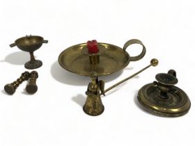 A collection of vintage brass items. Including chamber sticks, candle snuffer, miniature