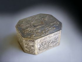 A Chinese embossed Silver box. Qing dynasty. Relief decorated with Peonies, Cherry blossom &