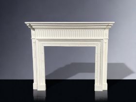 A WHITE MOULDED FIBREGLASS FIRE SURROUND.