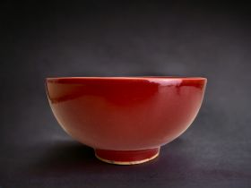 A Chinese red glazed porcelain bowl. Ming dynasty. Six character Jiajing marks. Property of an