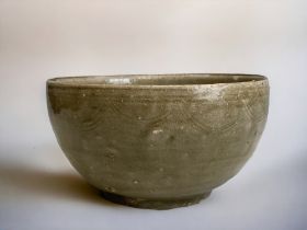 A Chinese Celadon glaze 'Shipwreck' bowl. Ming dynasty. Incised decoration. 7 x 13 cm