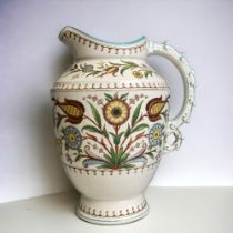 A VICTORIAN OLD HALL EWER. CAIRO PATTERN, ATTRIBUTED TO CHRISTOPHER DRESSER. CIRCA 1884. HEIGHT -