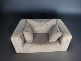 A GREY HEAL'S CHUNKY 'LOVESEAT' SOFA. Size: 150 cms in length, 106 cms in width and 60 cms in