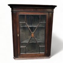 A VICTORIAN INLAID MAHOGANY GLAZED WALL CORNER CUPBOARD.