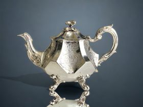 A Sterling Silver Rococo style teapot. By Angel brothers (Joseph Angell I & Joseph Angell II).