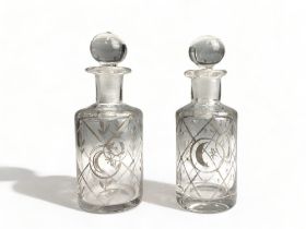 A Pair of 19th century gilded glass scent bottles, each bearing crescent and laurel wreath