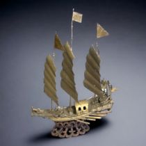 Large Chinese brass model of a junk on the water.