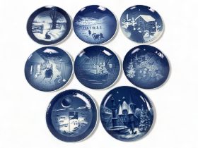 a collection of Eight Bing & Grondahl Copenhagen collectors plates. Including @jule after' Christmas