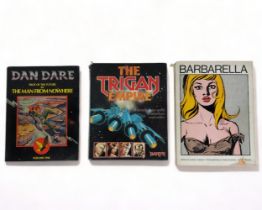 A 'Barbarella' graphic novel by Jean-Claude Forest, together with 'The Trigan Empire' and 'Dan