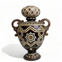 A GERBING & STEPHAN MAJOLICA TWIN HANDLE VASE. STYLISED PATTERNS & UNUSUAL BULBOUS NECK. CIRCA 1890.
