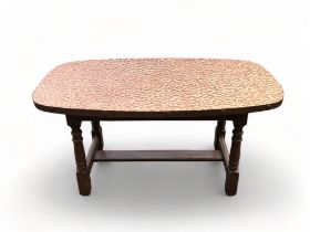 A RETRO COPPER MOUNTED COFFEE TABLE.