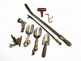 A Vintage colonial grass hand held slasher and other gardening tools