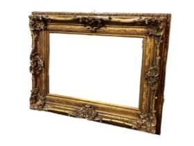 A large Rococo style wall mirror. 20th Century. 130 x 100cm