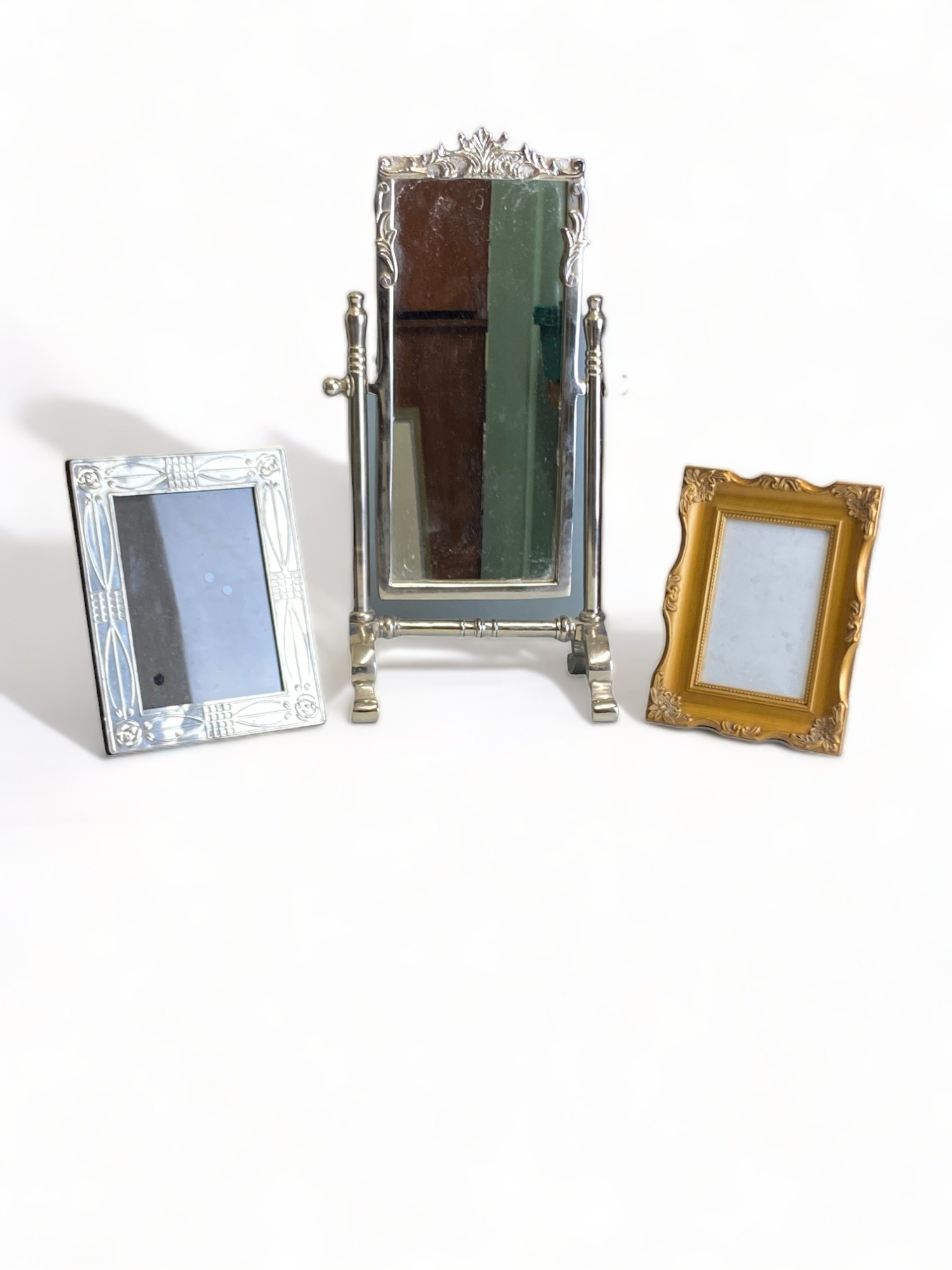 A LARGE METAL DESKTOP MIRROR, AND TWO PICTURE FRAMES