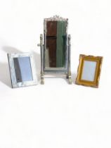 A LARGE METAL DESKTOP MIRROR, AND TWO PICTURE FRAMES