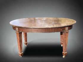 A VICTORIAN MAHOGANY OVAL EXTENDING DINING TABLE. RAISED ON SQUARE COLUMN LEGS, WITH CASTERS. AF