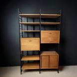 A MID-CENTURY STAPLES LADDERAX 2-BAY WALL SHELF UNIT. WITH DROP-FRONT COCKTAIL CUPBOARD. the