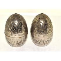 PAIR OF INDIAN WHITE METAL 'EGG' SALT & PEPPER SHAKERS. ENGRAVED IN A FOLIATE DESIGN. HEIGHT - 6CM