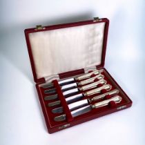A boxed set of six silver handled knives. Birmingham hallmarks. Length - 17cm AF - damage to join on