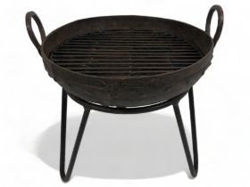 A Large Kadai Fire Pit with grill