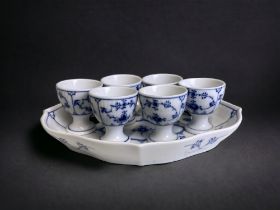 Royal Copenhagen 'blue fluted half lace' set of six egg cups, with stand.