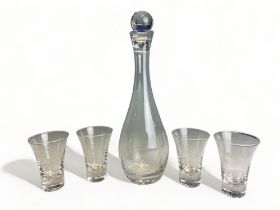 A LIQUEUR DECANTER AND GLASS SET WITH HAND ENGRAVED DESIGN