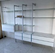 Wall and floor mounted 4-section Showroom Display Unit, with 4 drawer units and glass shelving,