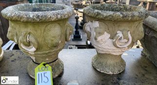 A pair of reconstituted stone garden Urns with lio