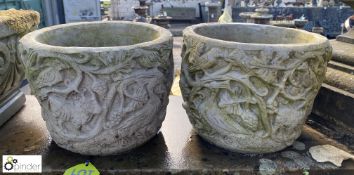 A pair of reconstituted stone garden Urns with myt