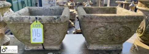 A pair of reconstituted stone Planters with fleur