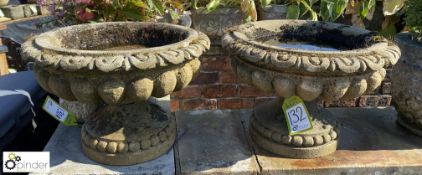 A pair of vintage Yorkshire grit stone carved garden Urns with egg and dart and gadrooning