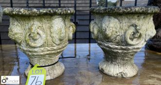 A pair of reconstituted stone Urns with lion mask