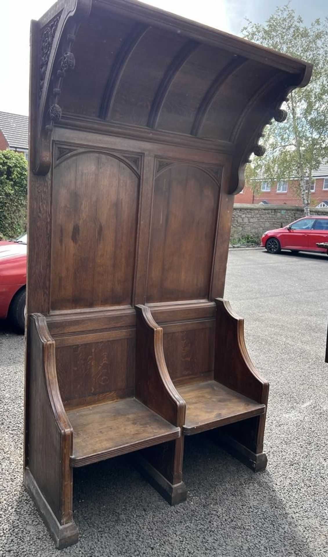 A hand carved gothic oak 2-seater Settle/Pew with
