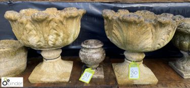 A pair of reconstituted stone Urns with acanthus l