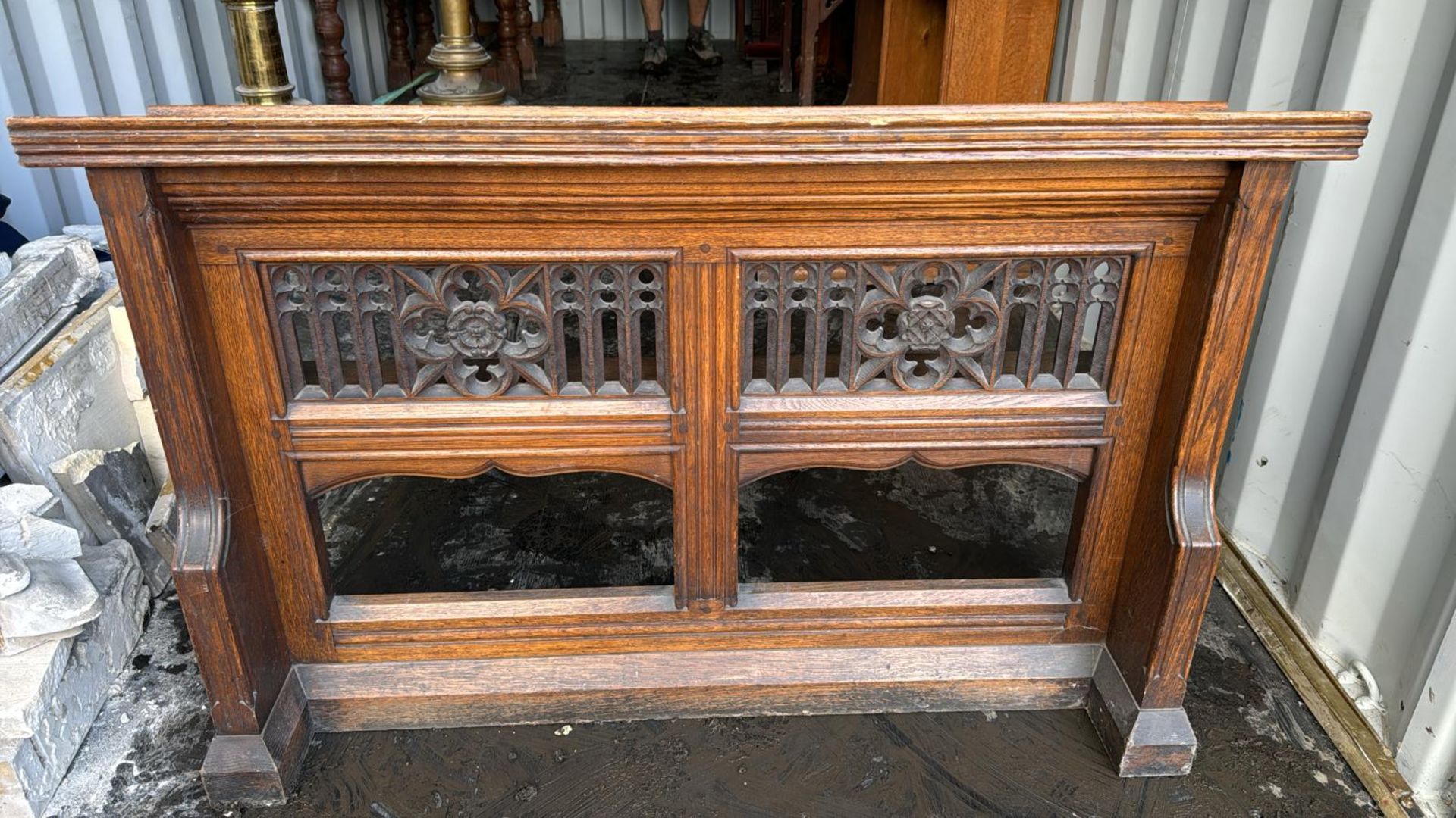 A carved gothic oak Pew Front, 32in high x 12in wi