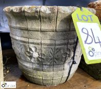 A reconstituted stone Planter with floral decorati