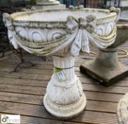A large reconstituted marble centre Urn with bow a