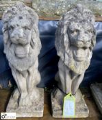 A pair of reconstituted stone seated lion Pier Cap