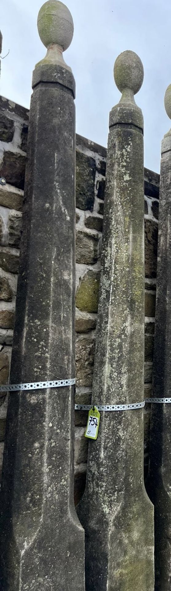 A pair reconstituted stone Obelisks, with ball fin