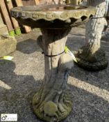 A reconstituted stone Bird Bath on a tree trunk st