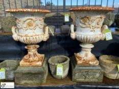 A genuine pair of cast iron Urns by Andrew Handysi