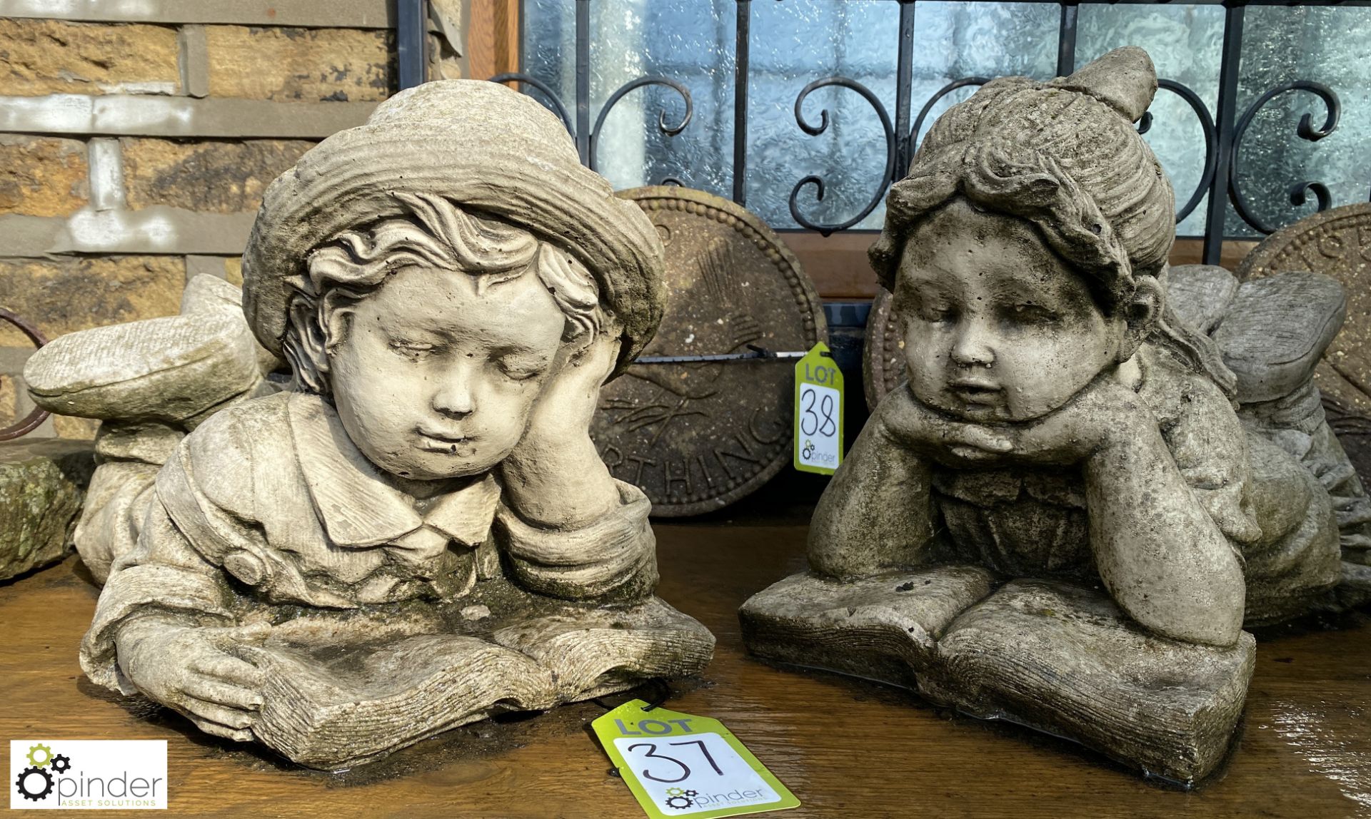 A pair of reconstituted stone Statue of children l