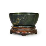 A CHINESE SPINACH JADE BASIN, 18TH CENTURY OR EARLIER