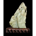 A VERY LARGE CHINESE JADE SEATED LUOHAN ON A MOUNTAIN WITH A DUCK & RECUMBENT RAM, 18TH CENTURY