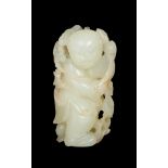 A CARVED CHINESE WHITE JADE FIGURE OF A BOY, 18TH CENTURY