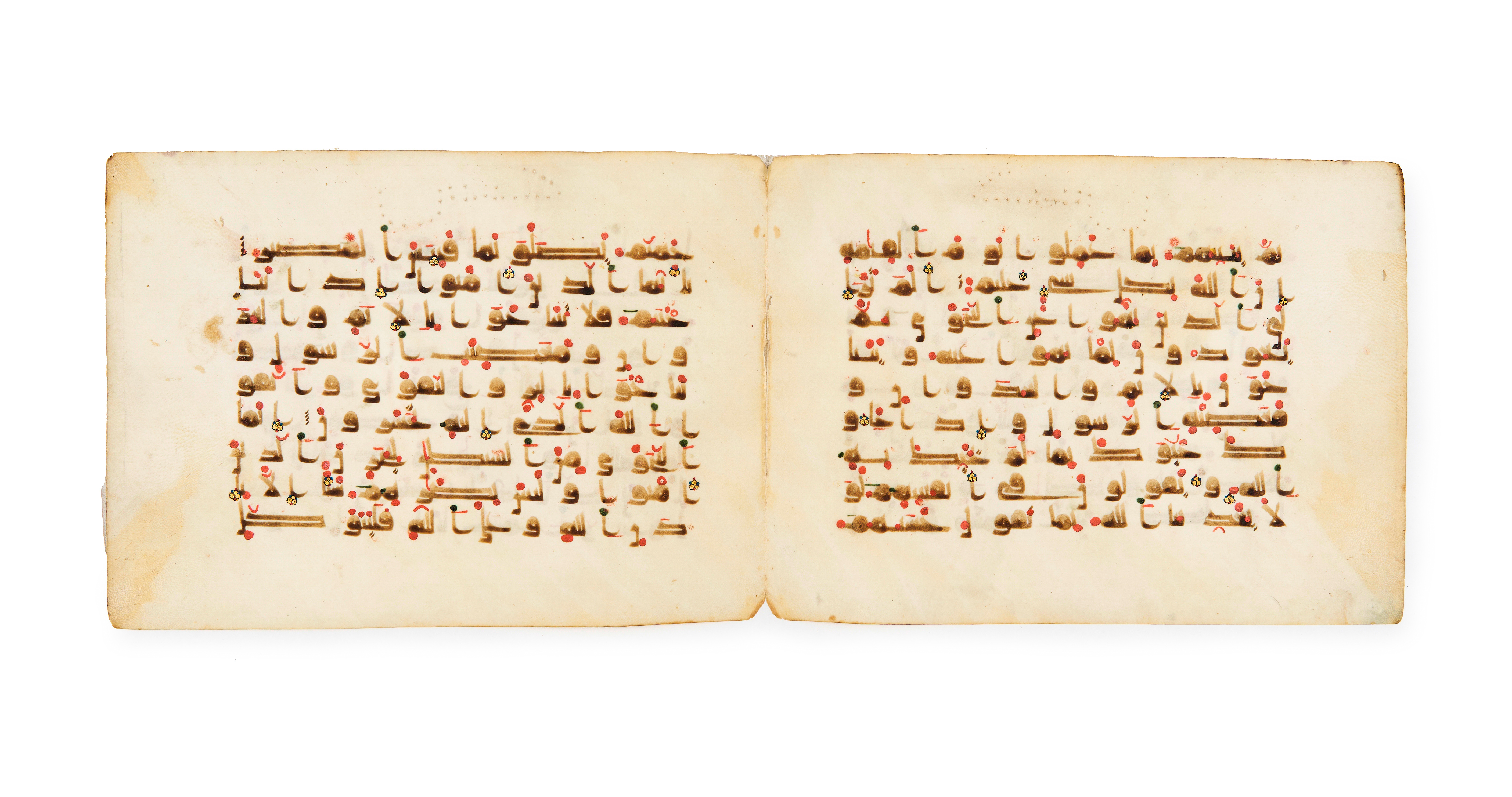 AN EXTREMELY LARGE QURAN KUFIC BIFOLIUM, 9TH/10TH CENTURY NORTH AFRICA OR WESTERN MEDITTERIAN