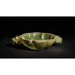 A LARGE ENGRAVED RAM HANDLED JADE BOWL SET WITH RUBY EYES, 19TH CENTURY