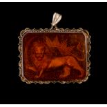 A LARGE ISLAMIC CARNELIAN PENDANT DEPICTING THE "SHIR" LION, SET ON SILVER, 19TH/20TH CENTURY